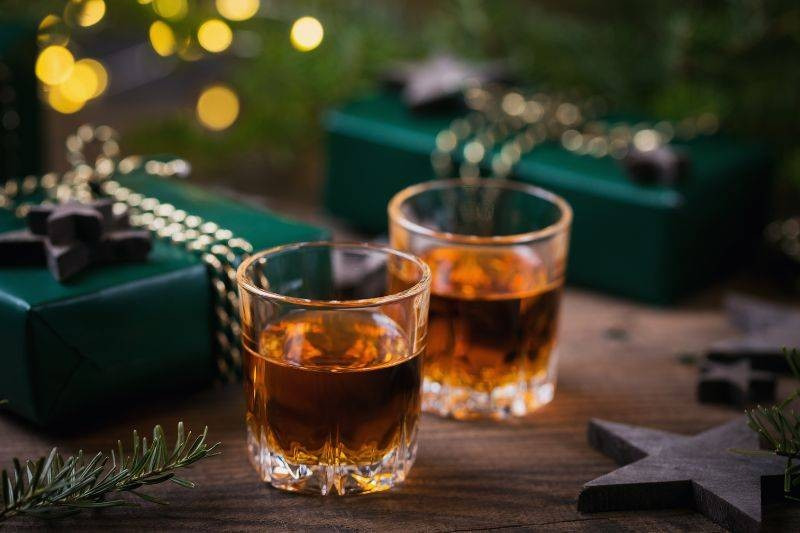  hand-picking-up-rusty-nail-cocktail-glass_1
